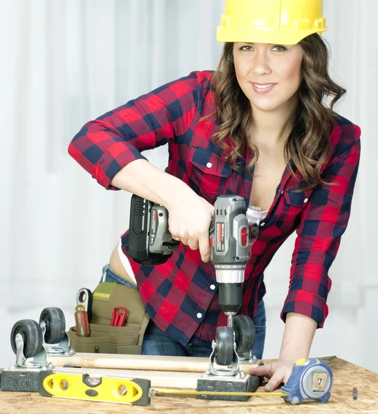 Woman Works on a Bench Repairing A Dolly — Stock Photo, Image