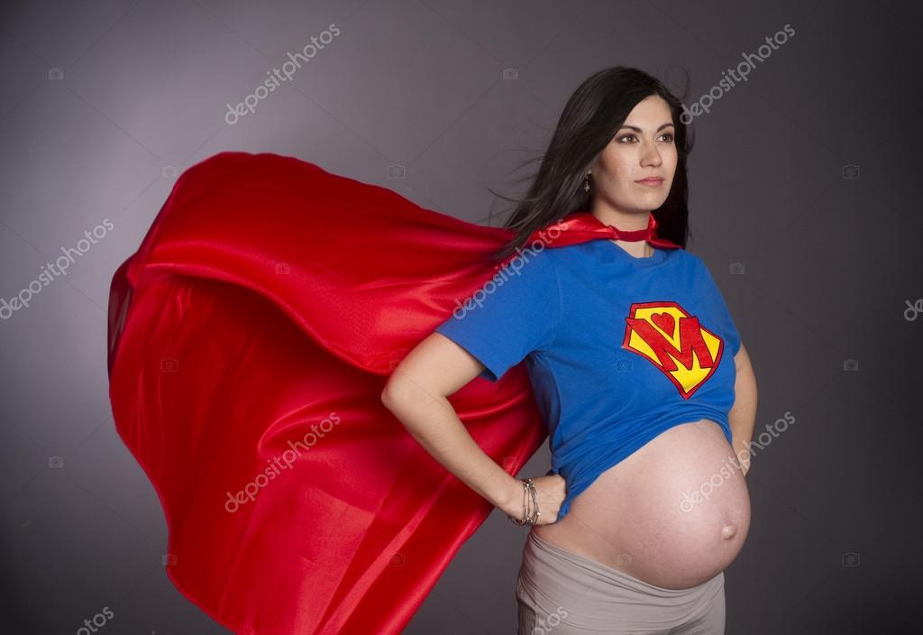 Woman expecting a baby dressed up as super hero