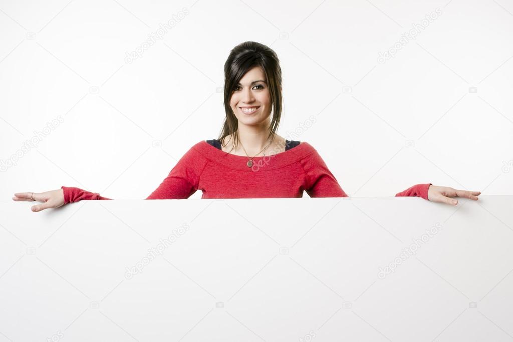 Female Presenter Stands Above Blank White Board Smiling Woman