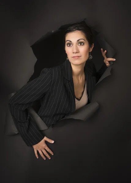 Beautiful Brunette Business Woman Breaks Through Tearing Hole in Wall — Stock Photo, Image