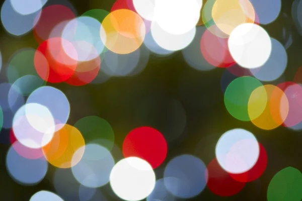 Luci di Natale orizzontale colore circolare sfondo arcobaleno bagliore — Foto Stock