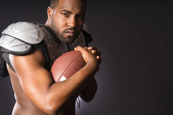 Angry African American Male Football Player Holds Ball Tight — Stock Photo, Image