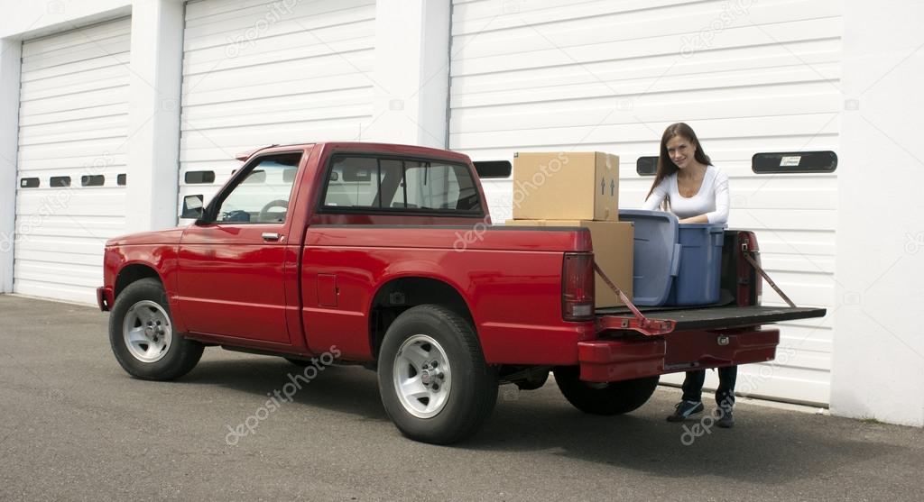 Attractive Female Loads Red Pickup Truck Storage Facility Moving