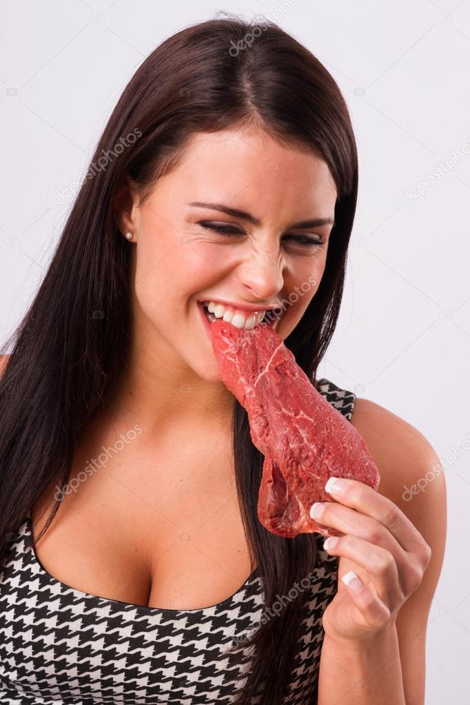 Beautiful Brunette Woman Bites Raw Red Steak Meat Eater