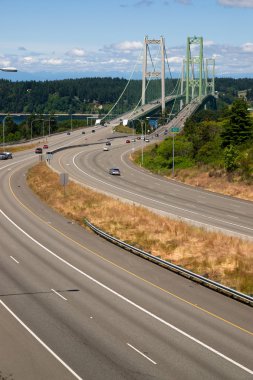 Highway 16 Crossing Puget Sound Over Tacoma Narrows Bridge clipart