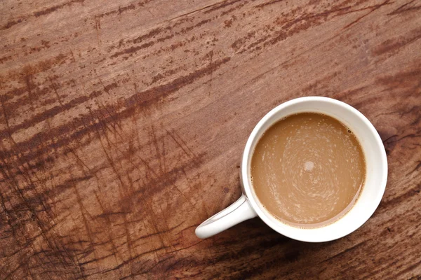 Xícara de café na mesa de madeira — Fotografia de Stock