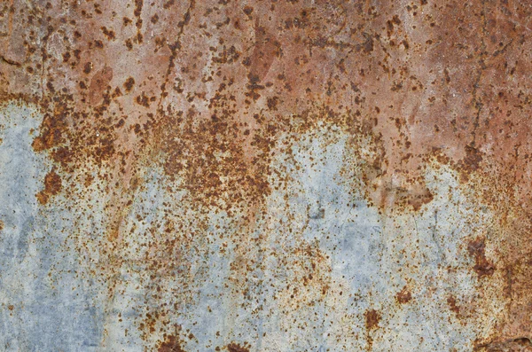 Uma textura de metal de ferro ondulado enferrujado — Fotografia de Stock
