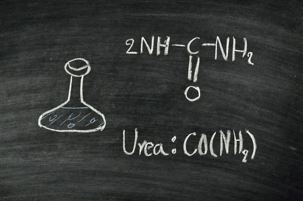 Urea acid on blackboard — Stock Photo, Image
