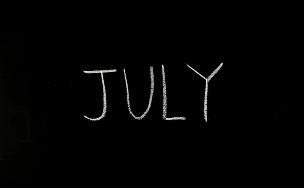 Word "july" on blackboard — Stock Photo, Image