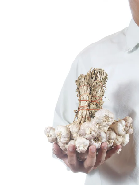 Empresário segurando garlics — Fotografia de Stock