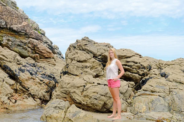 Blond girl posing on the beach — Stock Photo, Image