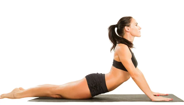 Fitness-Frau macht Dehnung auf Yoga und Pilates posieren auf isolierten Stockbild