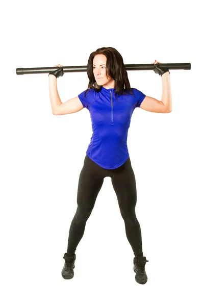 Young woman in sportswear working out in the gym with bodibard on isolate — Stock Photo, Image