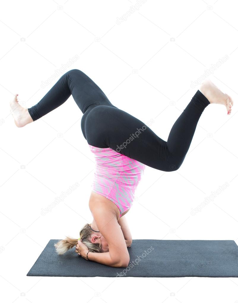 Pregnant fitness woman make stretch on yoga pose