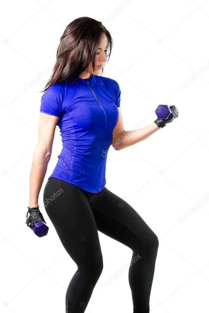 Young woman in sports bra workout in the gym with dumbbells on isolated whi