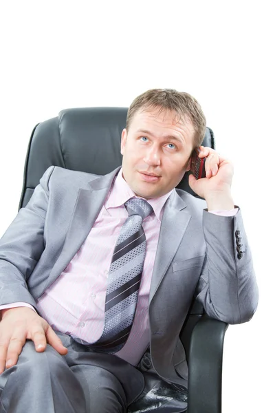 Attractive successful business man talk mobile phone and at isolated white — Stock Photo, Image