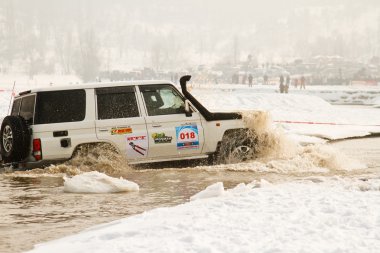 Almaty, Kazakhstan - February 11, 2012. Off-road racing jeeps, festival, d clipart