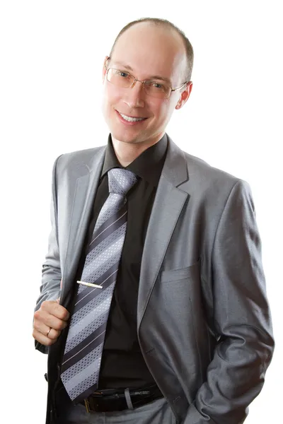 Uomo in abito grigio, cravatta e occhiali sullo sfondo bianco isolato — Foto Stock