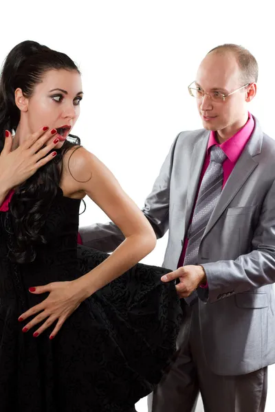 Loving couple - man see under skirt woman on white — Stock Image Loving couple - man see under skirt woman on white Royalty Free Stock Photos