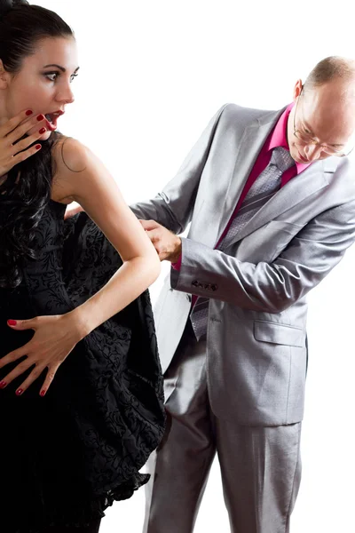 Loving couple - man see under skirt woman on white background — Stock Image Loving couple - man see under skirt woman on white background Stock Picture