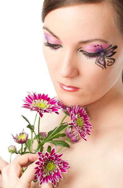 Pretty young woman with bodyart butterfly on face with flower chrysanthemu — Stock Photo, Image