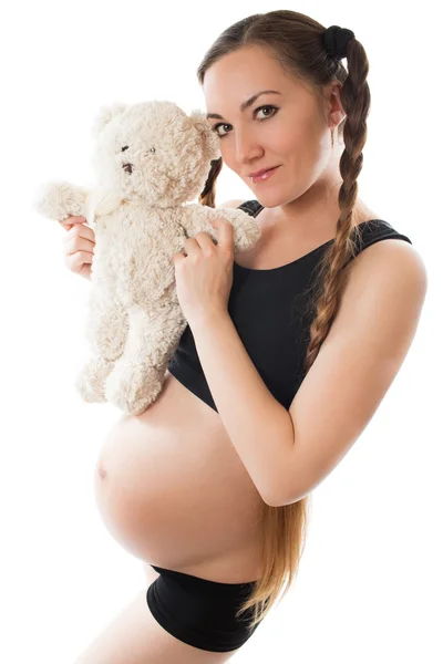 Έγκυος γυναίκα μαμά με παιχνίδι αρκουδάκι σε άσπρο φόντο — Φωτογραφία Αρχείου