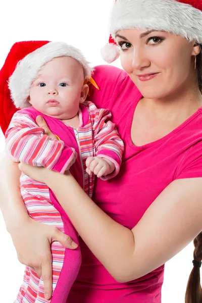 Mamãe e Papai Noel bebê filha celebrar o Natal em fundo branco isolado. O conceito de infância e férias — Fotografia de Stock