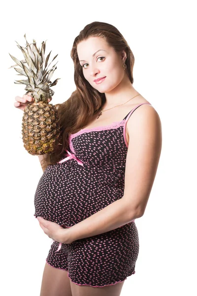 Pregnant woman with fresh pineapple on isolated white background The concept of food and healthy lifestyle — Stock Photo, Image