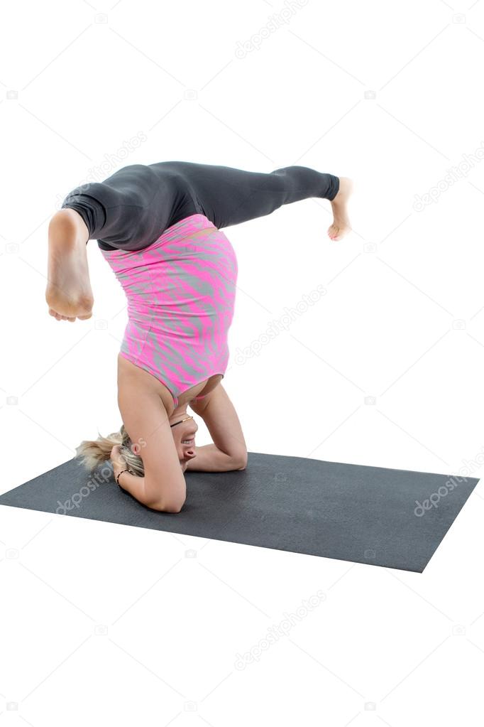 Pregnant fitness woman on yoga and pilates pose on white background The concept of Sport and Health