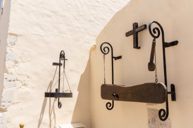 Greek religious symbol,cross,plaque with the name on wall of monastery in Crete, Greece clipart