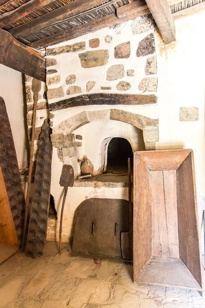 Oven-forged iron and ceramics in Museum with artifacts of ancient Greek pottery and clay in monastery in Messara Valley Crete, Greece — Stock Photo, Image