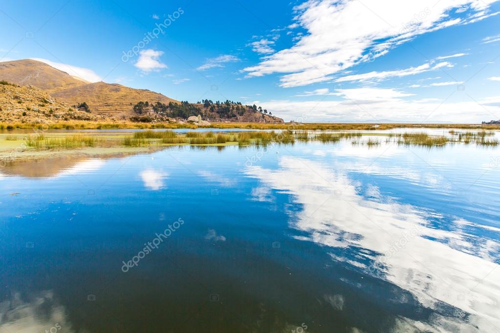 Lake Titicaca,South America, located on border of Peru and Bolivia. It sits 3,812 m above sea level, making it one of the highest commercially navigable lakes in the world.