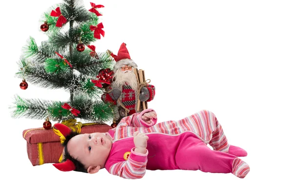 Santa baby girl near Christmas tree — Stock Photo, Image