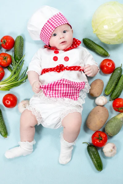 Het dragen van chef-kok hoed cook meisje van de baby — Stockfoto