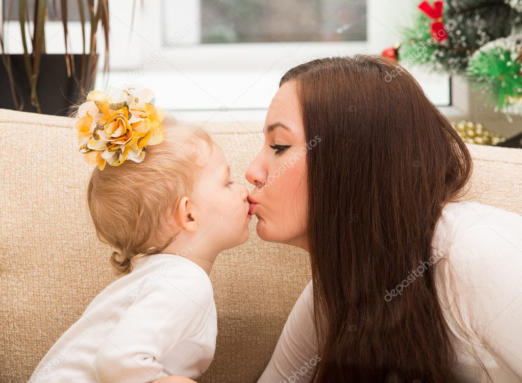 Mom and child kiss