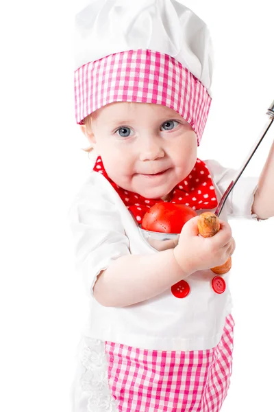 Baby boy in chef hat with carrot — Stock Photo, Image