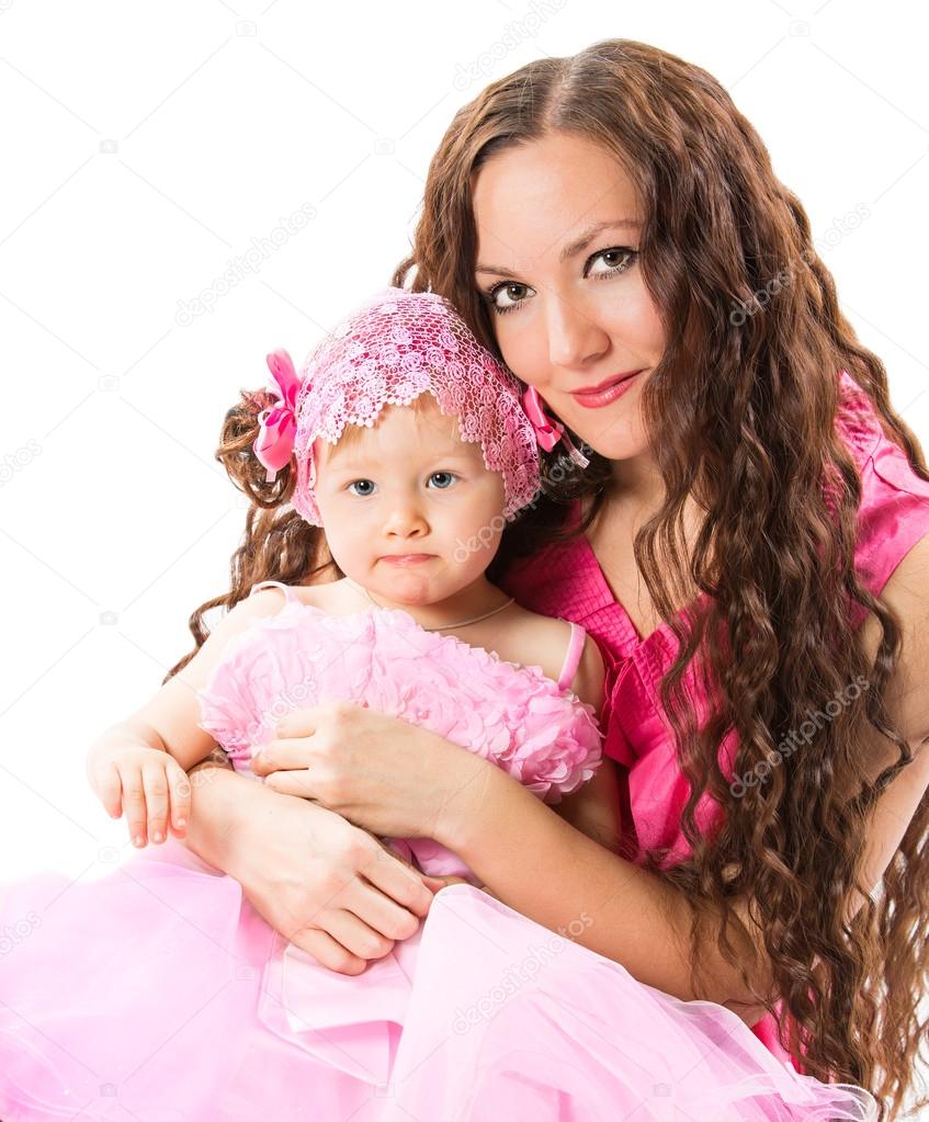 Mom and child girl hugging