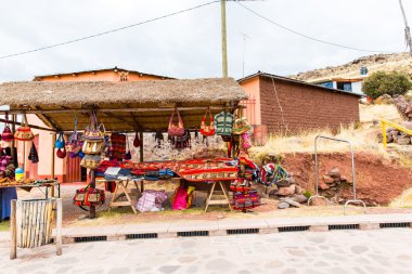 Souvenir market near towers in Sillustani, Peru, South America clipart