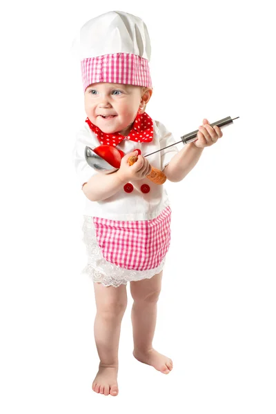 Dziewczynka kucharz kucharz kapeluszu ze świeżych warzyw i owoców — Zdjęcie stockowe