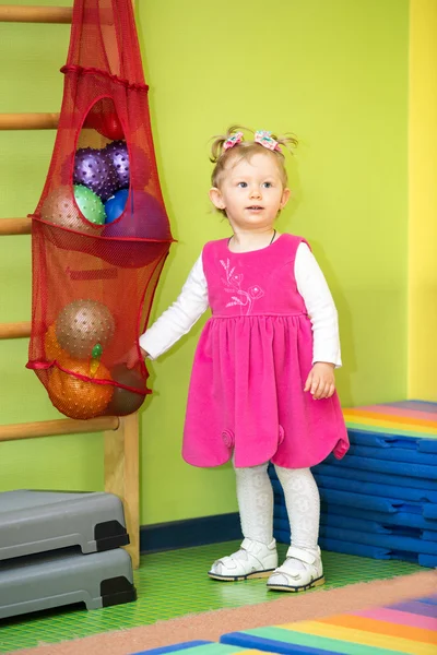Little child girl playing with ball in kindergarten — Stock Photo, Image