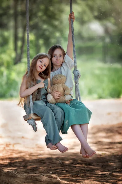 Happy Laughing Kids Girls Sisters Long Hair Enjoying Swing Ride — Stock Photo, Image