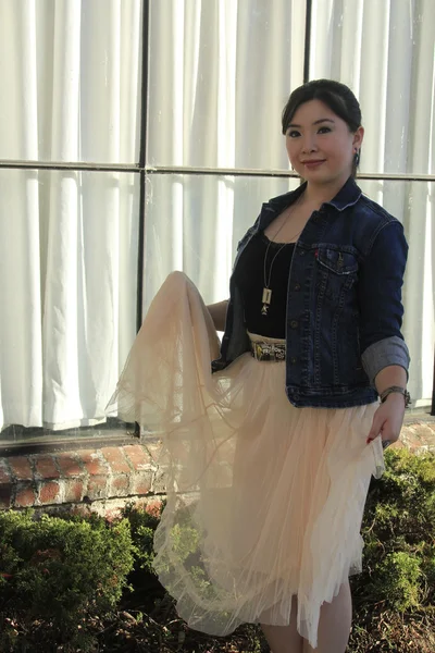 Asian model posing at the window — Stock Photo, Image