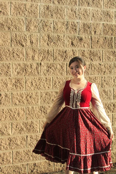 Vintage style barmaid posing near wall — Stock Photo, Image