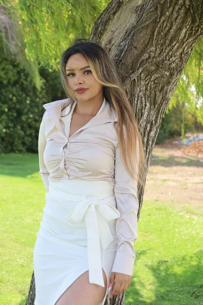 Photo of beautiful lady in a park on a summer day