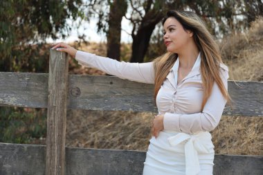 Photo of beautiful lady in a park on a summer day