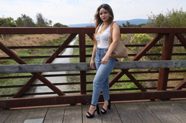 Photo of beautiful lady in a park on a summer day