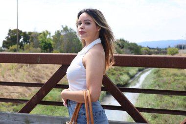 Photo of beautiful lady in a park on a summer day