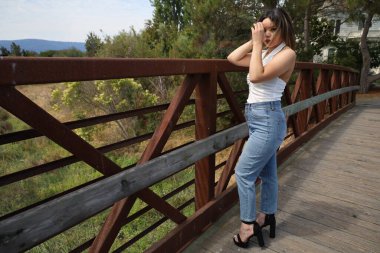 Photo of beautiful lady in a park on a summer day