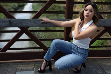 Photo of beautiful lady in a park on a summer day