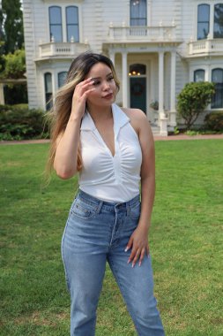 Photo of beautiful lady in a park on a summer day